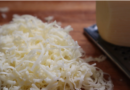 Why do most restaurants use pre-shredded cheese?